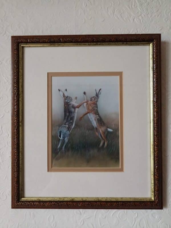 Two hares engaged in a spirited boxing match, beautifully captured in the Robert E Fuller, 1993 Boxing Hares artwork.